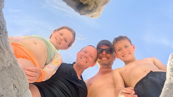 The four of us in a beach selfie taken from below