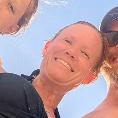 Rachel smiling on the beach